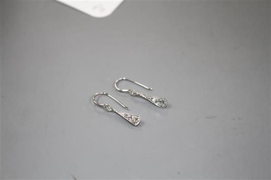 A pair of white metal and graduated diamond set fan-saped drop earrings, overall including ear wire 23mm, gross 1.1 grams.